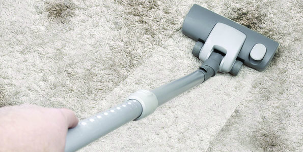 Vaccuming gray carpet